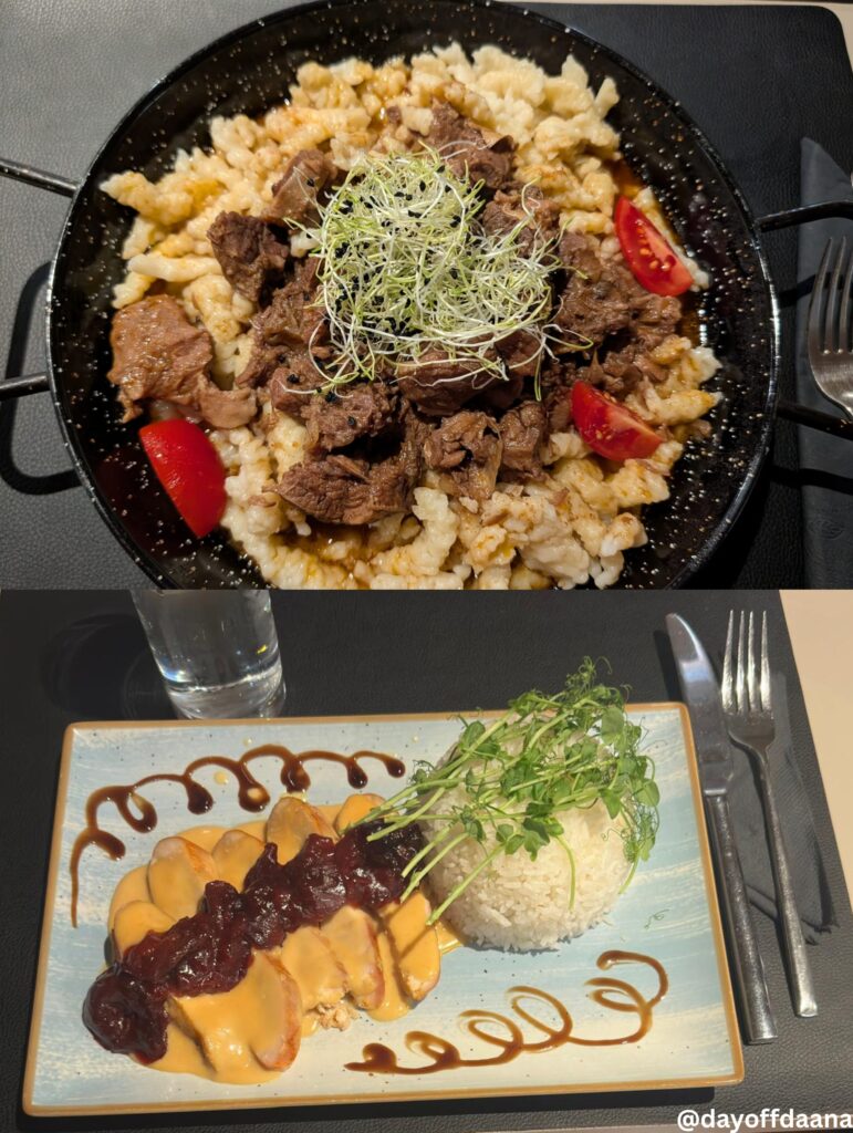 foto acima mostra uma carne vermelha ao molho de vinho tinto com dumplings, acompanhada, claro, de um bom vinho tinto.
em baixo a escolha de uma amiga um peito de peru com arroz e molho de ameixa, que também estava delicioso.
apreciar a culinaria local nao pode faltar na sua lista odo que fazer em budapesteInfelizmente não conseguimos provar a sobremesa, porque a cozinha já havia fechado, mas a experiência valeu cada minuto — e cada taça!